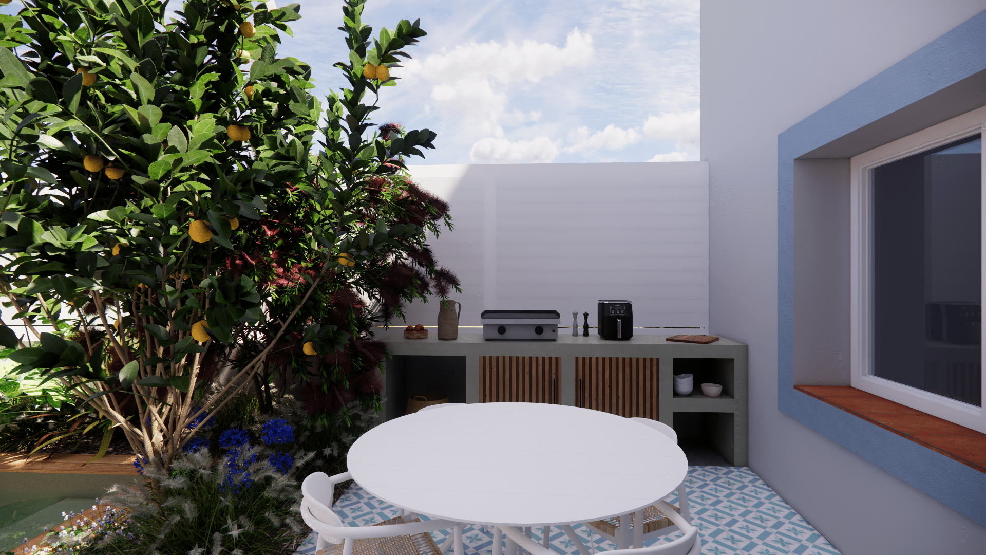 Terrasse avec cuisine d'été, table ronde blanche, citronnier et sol en carreaux de ciment bleus.