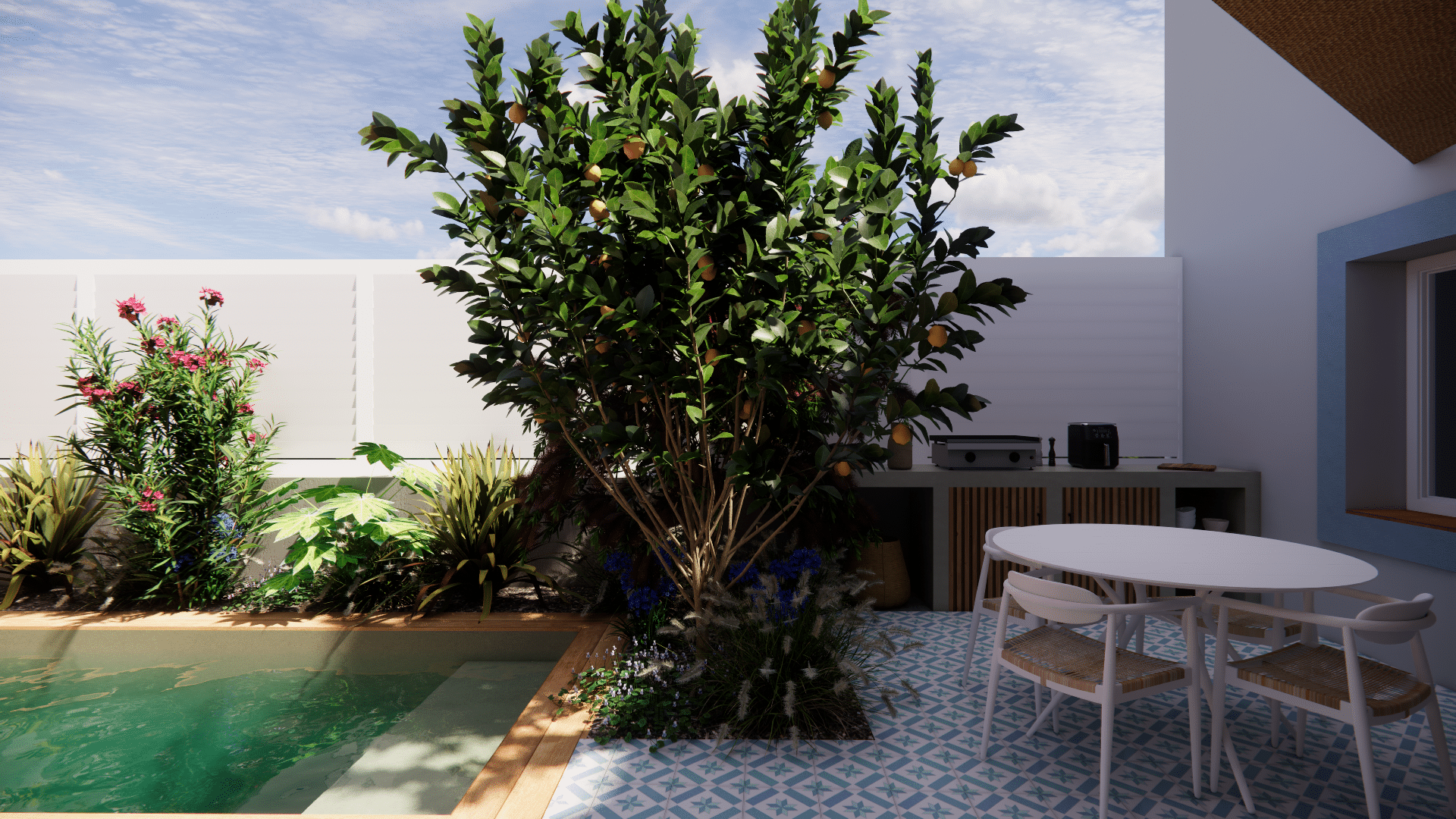 Terrasse avec piscine, citronnier chargé de fruits et table à manger blanche sur carrelage à motifs bleus.